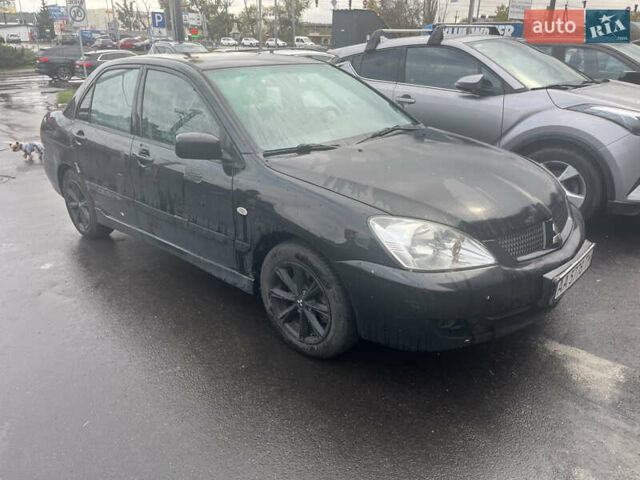 Чорний Міцубісі Lancer, об'ємом двигуна 1.58 л та пробігом 257 тис. км за 2400 $, фото 1 на Automoto.ua