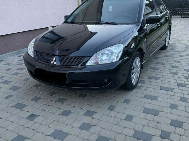 Черный Мицубиси Лансер, объемом двигателя 1.6 л и пробегом 178 тыс. км за 4800 $, фото 1 на Automoto.ua