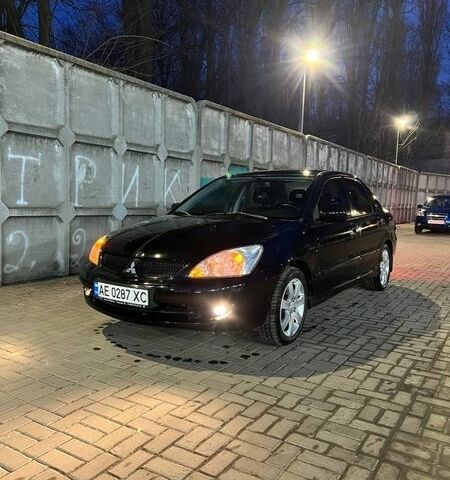 Черный Мицубиси Лансер, объемом двигателя 1.59 л и пробегом 202 тыс. км за 5000 $, фото 1 на Automoto.ua