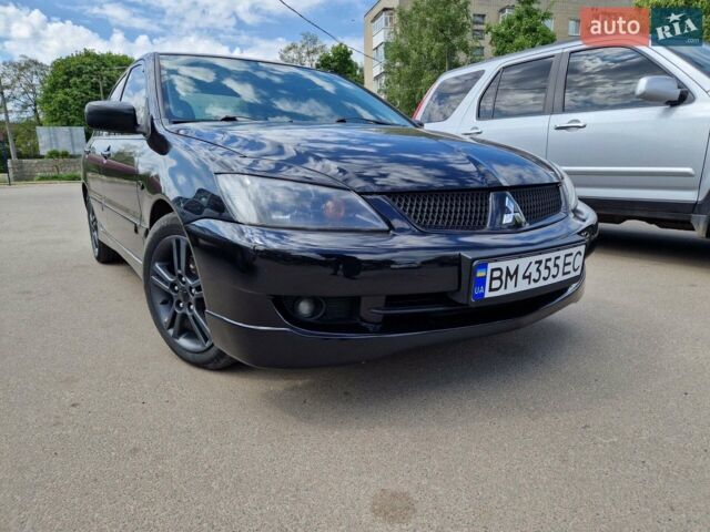 Чорний Міцубісі Lancer, об'ємом двигуна 2 л та пробігом 290 тис. км за 5000 $, фото 1 на Automoto.ua