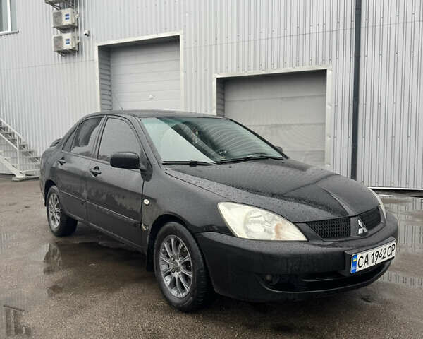 Черный Мицубиси Лансер, объемом двигателя 1.6 л и пробегом 368 тыс. км за 3200 $, фото 1 на Automoto.ua