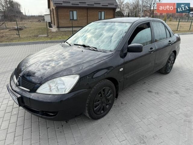 Черный Мицубиси Лансер, объемом двигателя 1.58 л и пробегом 310 тыс. км за 2999 $, фото 1 на Automoto.ua