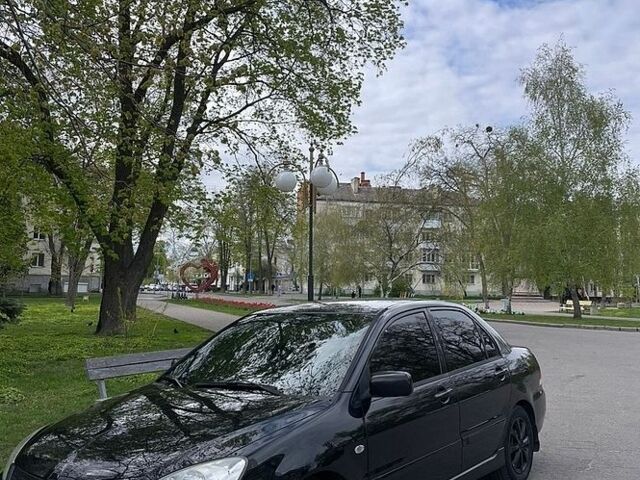 Чорний Міцубісі Lancer, об'ємом двигуна 1.58 л та пробігом 293 тис. км за 4000 $, фото 1 на Automoto.ua
