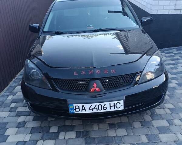 Черный Мицубиси Лансер, объемом двигателя 2 л и пробегом 232 тыс. км за 5800 $, фото 1 на Automoto.ua