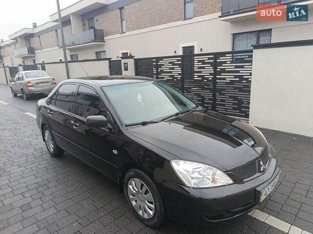 Черный Мицубиси Лансер, объемом двигателя 1.6 л и пробегом 187 тыс. км за 3600 $, фото 1 на Automoto.ua