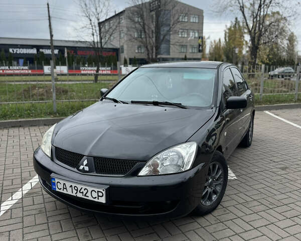 Черный Мицубиси Лансер, объемом двигателя 1.58 л и пробегом 370 тыс. км за 3500 $, фото 1 на Automoto.ua