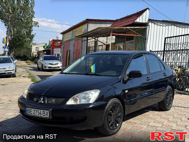 Черный Мицубиси Лансер, объемом двигателя 1.6 л и пробегом 300 тыс. км за 3599 $, фото 1 на Automoto.ua