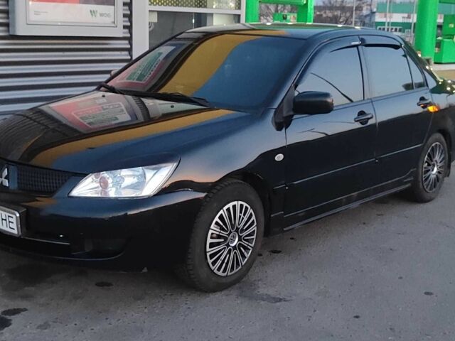 Черный Мицубиси Лансер, объемом двигателя 1.6 л и пробегом 245 тыс. км за 4100 $, фото 1 на Automoto.ua