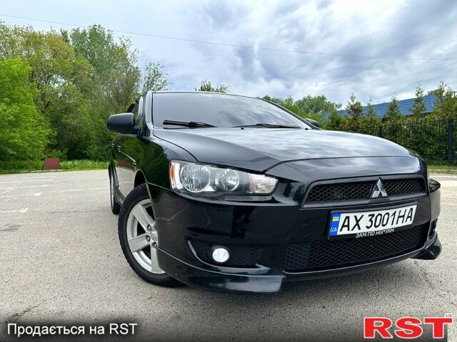 Чорний Міцубісі Lancer, об'ємом двигуна 2 л та пробігом 230 тис. км за 7000 $, фото 1 на Automoto.ua