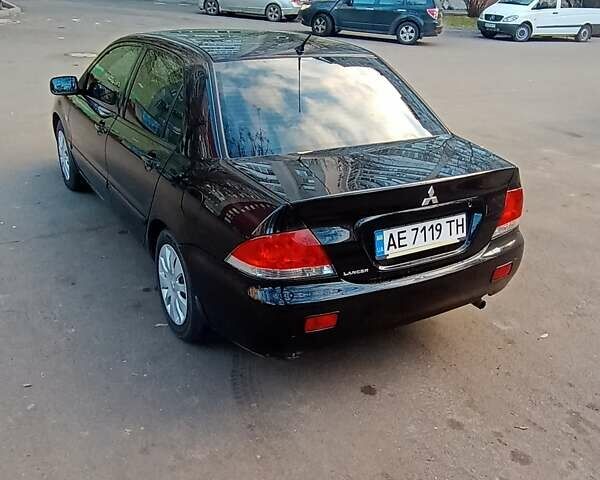 Чорний Міцубісі Lancer, об'ємом двигуна 1.6 л та пробігом 296 тис. км за 4500 $, фото 1 на Automoto.ua