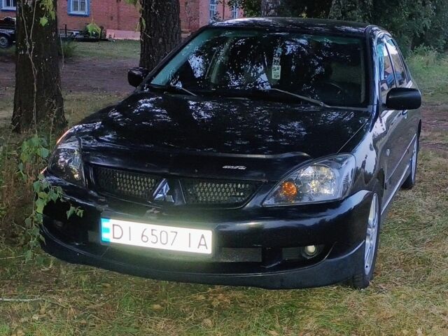 Чорний Міцубісі Lancer, об'ємом двигуна 2 л та пробігом 267 тис. км за 5108 $, фото 1 на Automoto.ua
