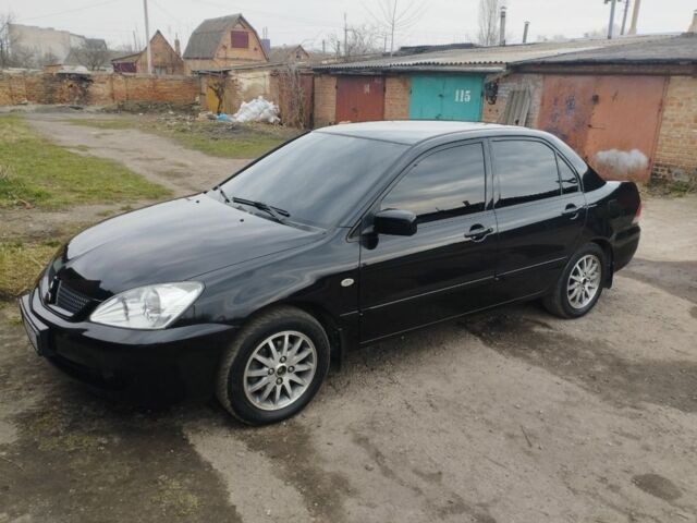 Черный Мицубиси Лансер, объемом двигателя 1.6 л и пробегом 187 тыс. км за 6200 $, фото 1 на Automoto.ua