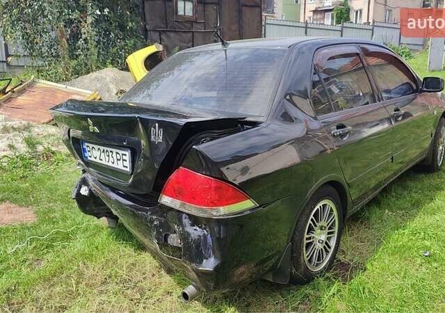 Черный Мицубиси Лансер, объемом двигателя 1.6 л и пробегом 22 тыс. км за 1700 $, фото 1 на Automoto.ua