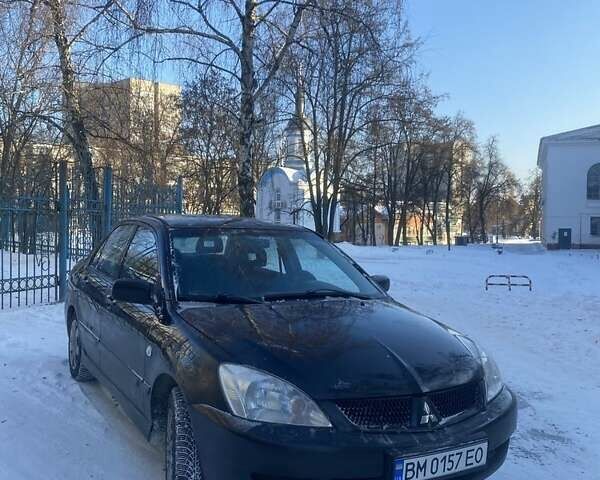 Черный Мицубиси Лансер, объемом двигателя 1.6 л и пробегом 291 тыс. км за 3850 $, фото 1 на Automoto.ua