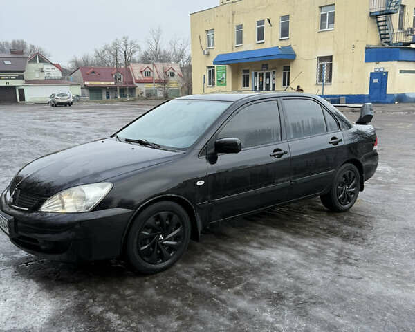 Черный Мицубиси Лансер, объемом двигателя 1.6 л и пробегом 112 тыс. км за 4700 $, фото 1 на Automoto.ua