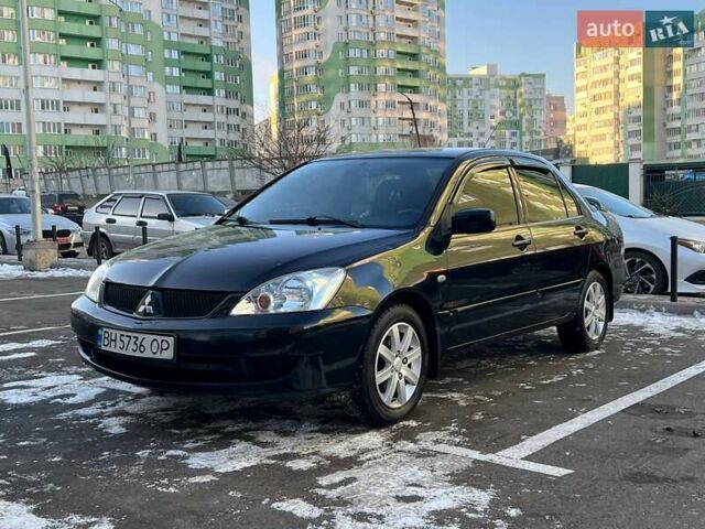 Чорний Міцубісі Lancer, об'ємом двигуна 1.58 л та пробігом 184 тис. км за 5500 $, фото 1 на Automoto.ua