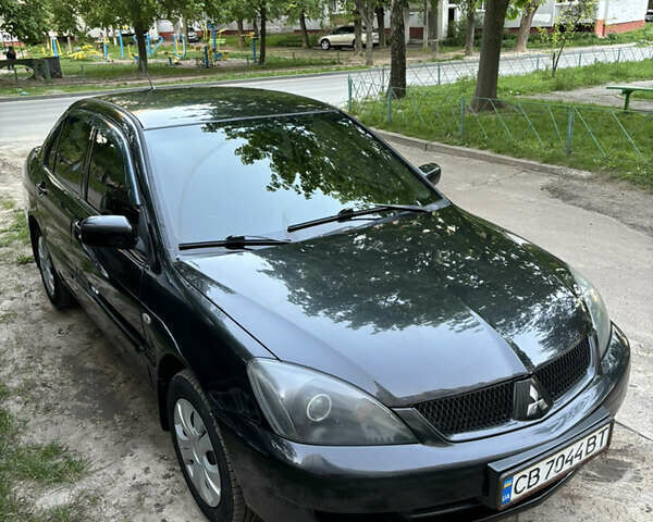 Чорний Міцубісі Lancer, об'ємом двигуна 1.6 л та пробігом 217 тис. км за 4500 $, фото 1 на Automoto.ua