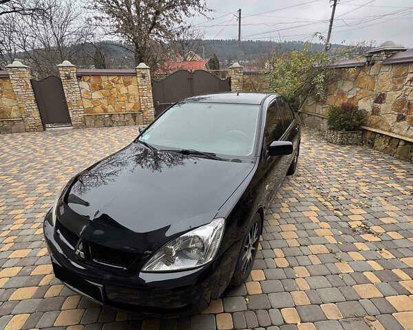 Чорний Міцубісі Lancer, об'ємом двигуна 1.6 л та пробігом 138 тис. км за 5450 $, фото 1 на Automoto.ua