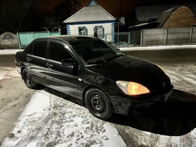 Черный Мицубиси Лансер, объемом двигателя 1.6 л и пробегом 227 тыс. км за 3400 $, фото 1 на Automoto.ua