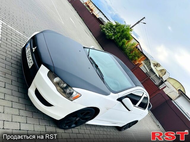 Черный Мицубиси Лансер, объемом двигателя 2 л и пробегом 195 тыс. км за 5500 $, фото 1 на Automoto.ua