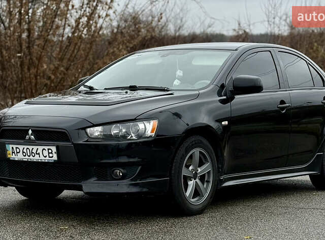 Черный Мицубиси Лансер, объемом двигателя 2 л и пробегом 215 тыс. км за 5500 $, фото 1 на Automoto.ua