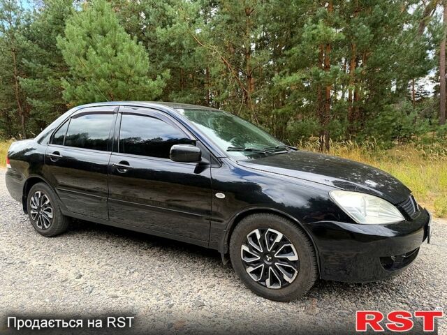 Чорний Міцубісі Lancer, об'ємом двигуна 1.6 л та пробігом 227 тис. км за 3350 $, фото 1 на Automoto.ua