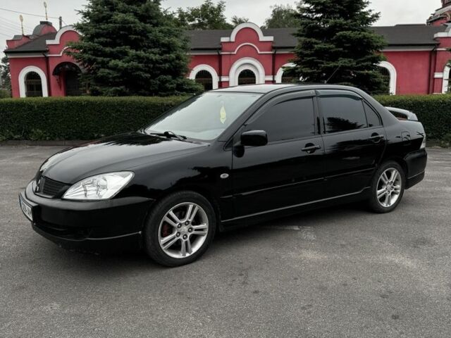 Чорний Міцубісі Lancer, об'ємом двигуна 2 л та пробігом 222 тис. км за 4900 $, фото 1 на Automoto.ua