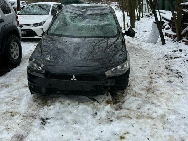 Черный Мицубиси Лансер, объемом двигателя 2 л и пробегом 197 тыс. км за 2500 $, фото 1 на Automoto.ua