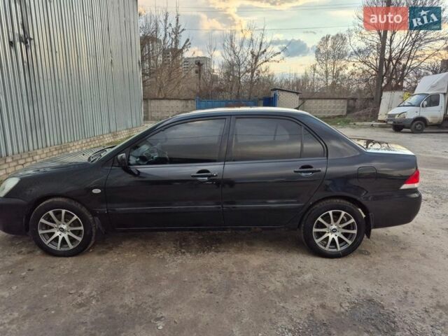 Чорний Міцубісі Lancer, об'ємом двигуна 1.6 л та пробігом 239 тис. км за 4200 $, фото 1 на Automoto.ua