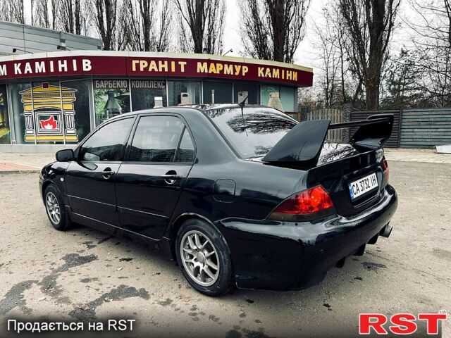 Черный Мицубиси Лансер, объемом двигателя 1.6 л и пробегом 258 тыс. км за 3900 $, фото 1 на Automoto.ua