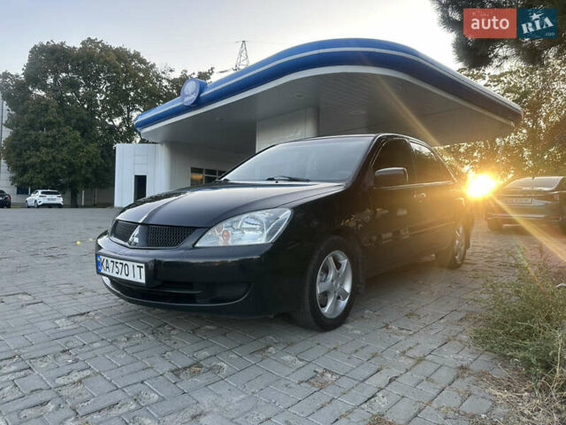 Черный Мицубиси Лансер, объемом двигателя 1.59 л и пробегом 269 тыс. км за 4999 $, фото 1 на Automoto.ua