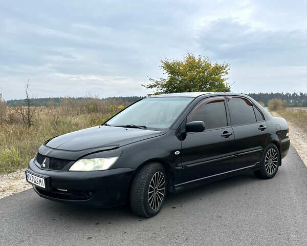 Чорний Міцубісі Lancer, об'ємом двигуна 1.6 л та пробігом 212 тис. км за 4700 $, фото 1 на Automoto.ua