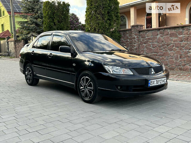 Чорний Міцубісі Lancer, об'ємом двигуна 1.58 л та пробігом 229 тис. км за 3900 $, фото 1 на Automoto.ua