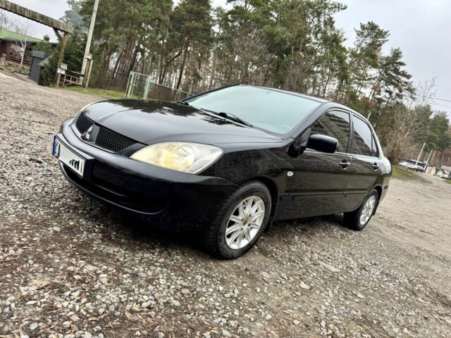 Чорний Міцубісі Lancer, об'ємом двигуна 1.6 л та пробігом 216 тис. км за 4990 $, фото 1 на Automoto.ua