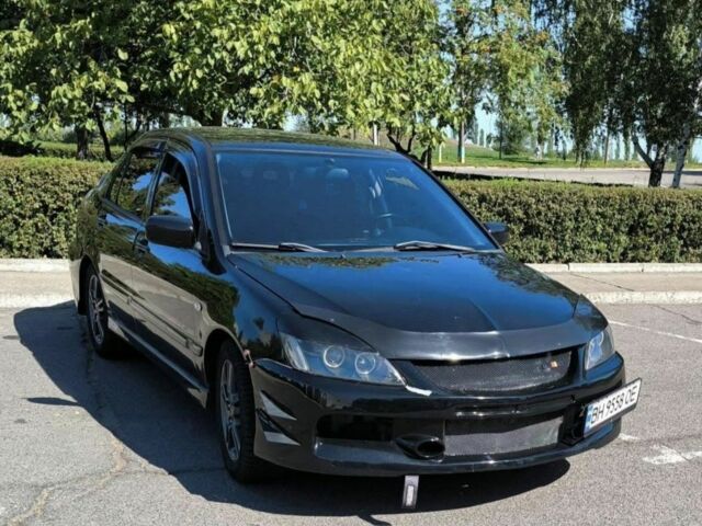 Черный Мицубиси Лансер, объемом двигателя 2 л и пробегом 161 тыс. км за 4500 $, фото 1 на Automoto.ua