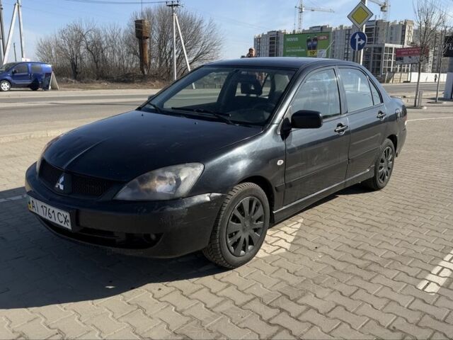 Черный Мицубиси Лансер, объемом двигателя 1.6 л и пробегом 300 тыс. км за 2999 $, фото 1 на Automoto.ua