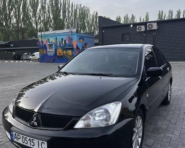 Чорний Міцубісі Lancer, об'ємом двигуна 1.58 л та пробігом 203 тис. км за 5200 $, фото 1 на Automoto.ua