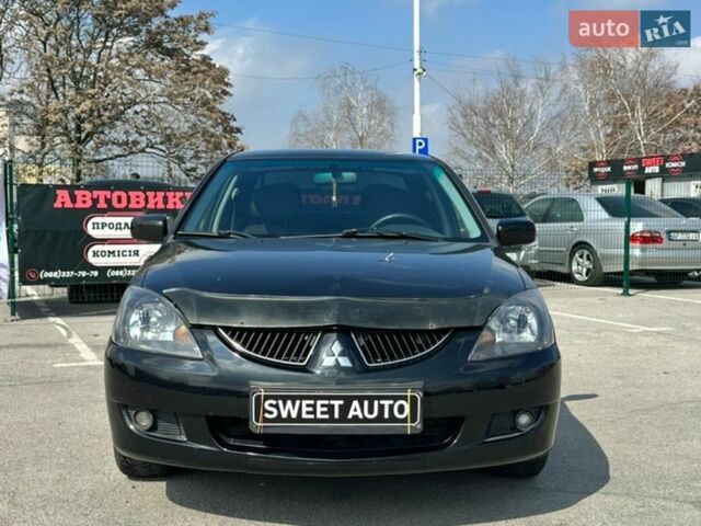 Чорний Міцубісі Lancer, об'ємом двигуна 1.6 л та пробігом 226 тис. км за 3899 $, фото 1 на Automoto.ua