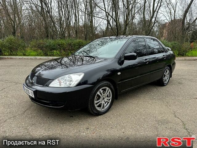 Черный Мицубиси Лансер, объемом двигателя 1.6 л и пробегом 173 тыс. км за 4650 $, фото 1 на Automoto.ua