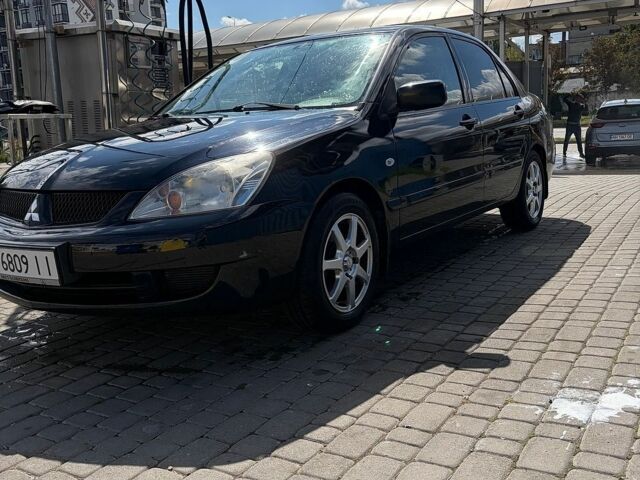 Чорний Міцубісі Lancer, об'ємом двигуна 1.59 л та пробігом 201 тис. км за 4000 $, фото 1 на Automoto.ua