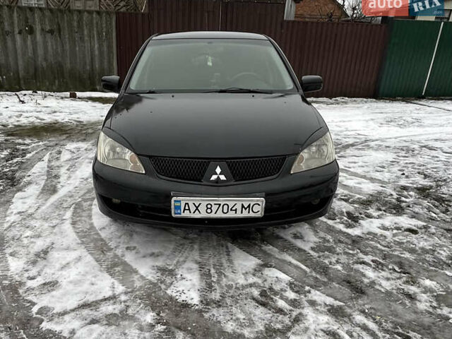 Черный Мицубиси Лансер, объемом двигателя 1.6 л и пробегом 208 тыс. км за 4100 $, фото 1 на Automoto.ua