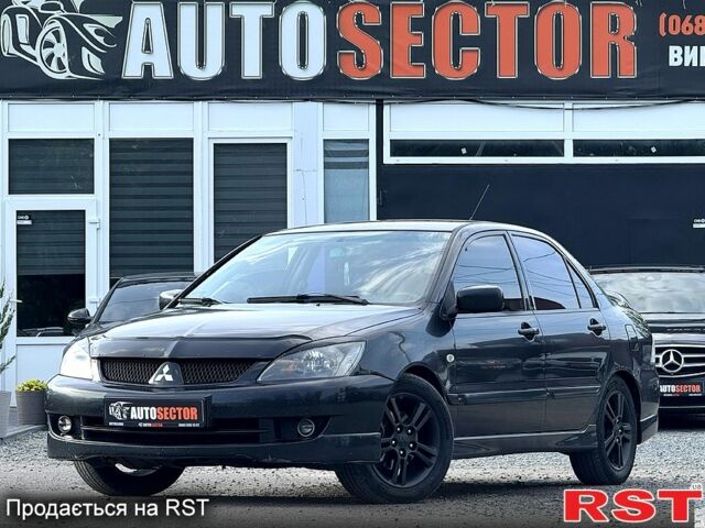 Черный Мицубиси Лансер, объемом двигателя 1.6 л и пробегом 260 тыс. км за 3700 $, фото 1 на Automoto.ua