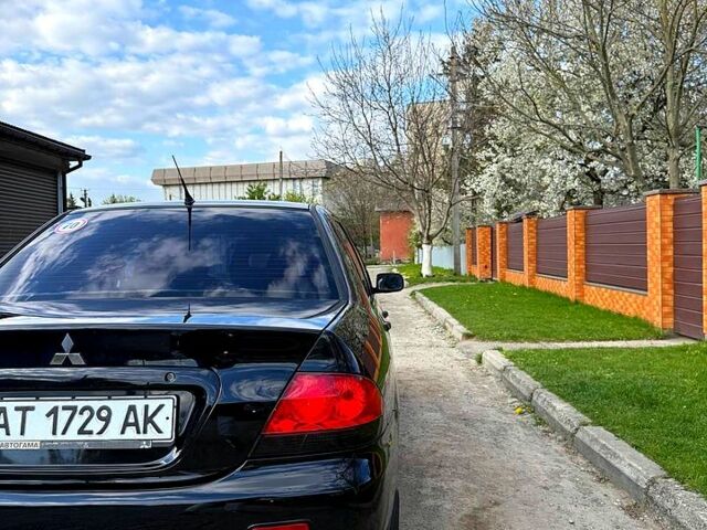 Черный Мицубиси Лансер, объемом двигателя 1.6 л и пробегом 169 тыс. км за 4900 $, фото 1 на Automoto.ua