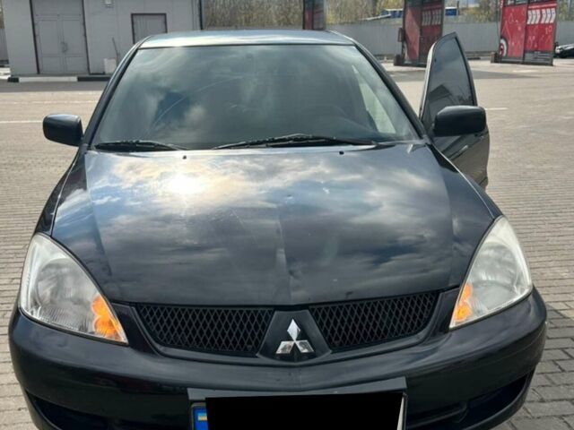 Чорний Міцубісі Lancer, об'ємом двигуна 1.6 л та пробігом 179 тис. км за 3800 $, фото 1 на Automoto.ua