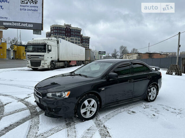 Чорний Міцубісі Lancer, об'ємом двигуна 2 л та пробігом 199 тис. км за 7000 $, фото 1 на Automoto.ua