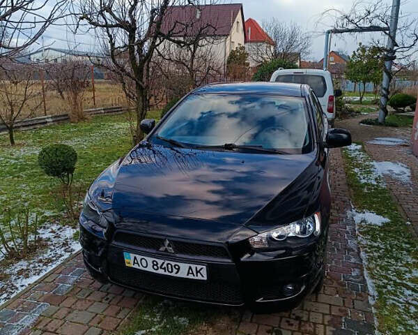 Черный Мицубиси Лансер, объемом двигателя 2 л и пробегом 236 тыс. км за 6100 $, фото 1 на Automoto.ua