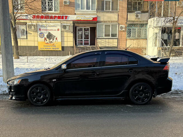 Чорний Міцубісі Lancer, об'ємом двигуна 2 л та пробігом 253 тис. км за 6800 $, фото 1 на Automoto.ua