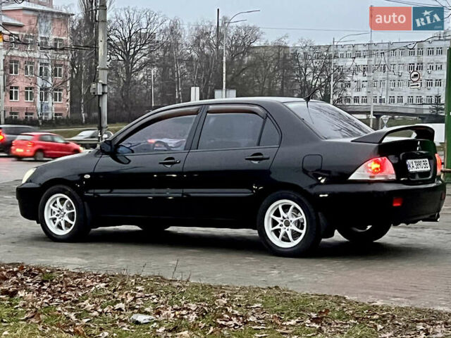 Чорний Міцубісі Lancer, об'ємом двигуна 1.6 л та пробігом 303 тис. км за 4350 $, фото 1 на Automoto.ua