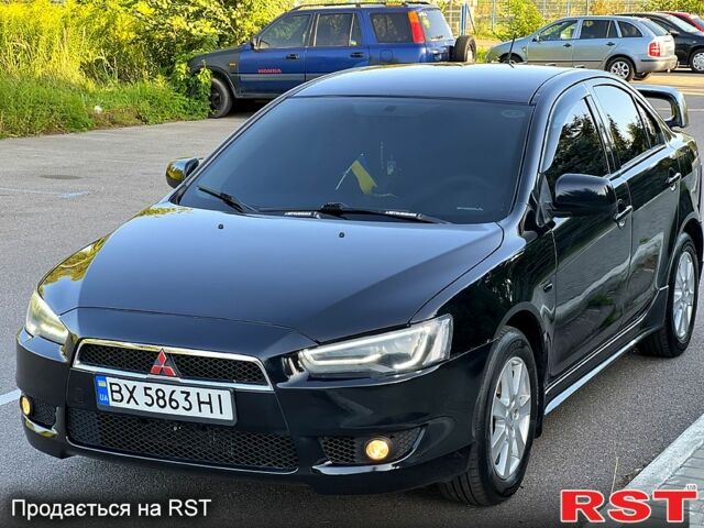 Черный Мицубиси Лансер, объемом двигателя 2 л и пробегом 216 тыс. км за 7500 $, фото 1 на Automoto.ua