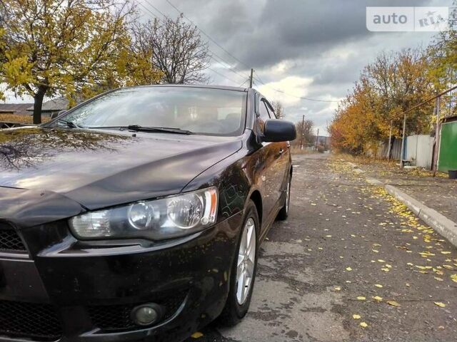 Чорний Міцубісі Lancer, об'ємом двигуна 2 л та пробігом 170 тис. км за 7600 $, фото 1 на Automoto.ua